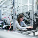 Manufacturing - woman in white long sleeve shirt using black laptop computer