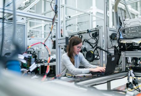 Manufacturing - woman in white long sleeve shirt using black laptop computer