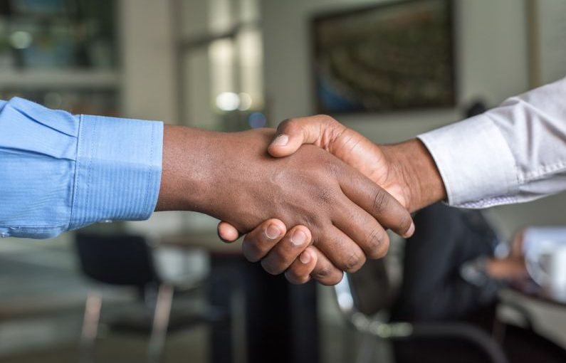 Partnership Business - two people shaking hands