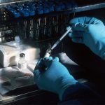 Biotech - person holding silver and black hand tool