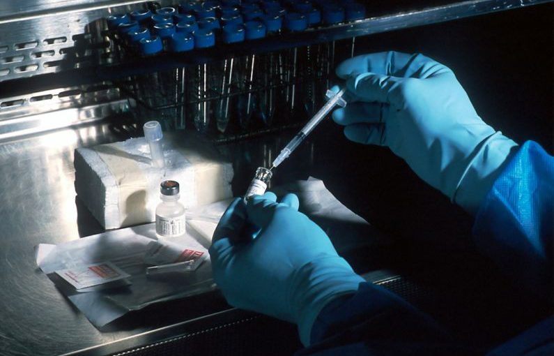 Biotech - person holding silver and black hand tool