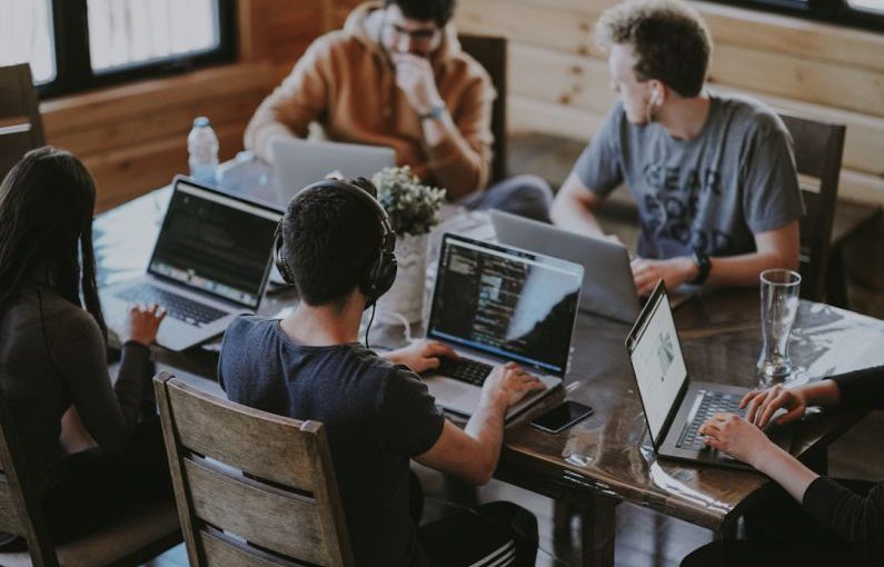 Startups - group of people using laptop computer