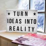 Startups - white and black wooden quote board