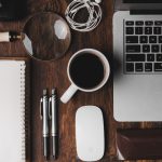 Work - cup of coffee near MacBook Pro