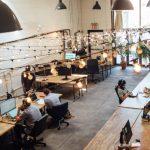 Coworking Spaces - people sitting in front of computer monitors