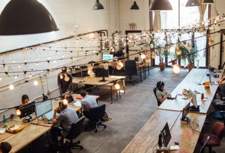 Coworking Spaces - people sitting in front of computer monitors