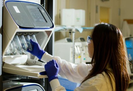 Biotechnology - woman holding test tubes