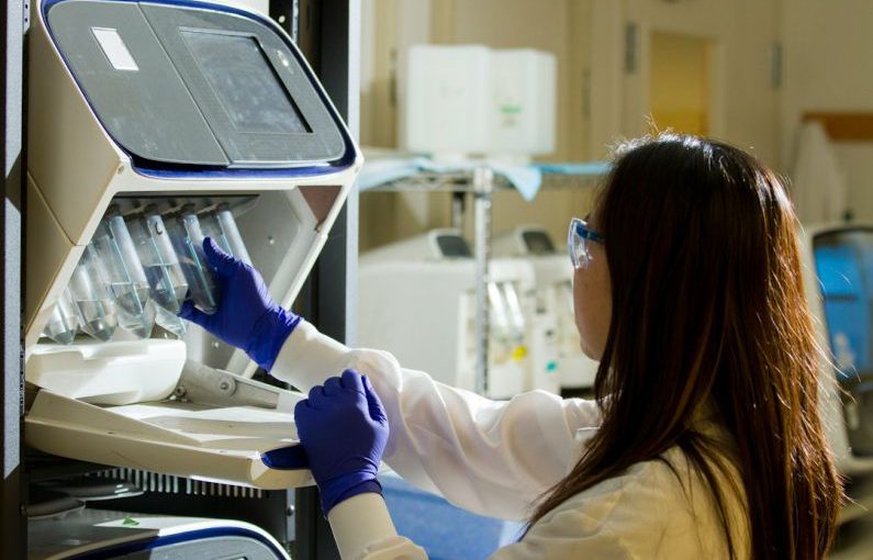 Biotechnology - woman holding test tubes