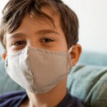 Safety Compliance - boy in blue crew neck shirt with white face mask