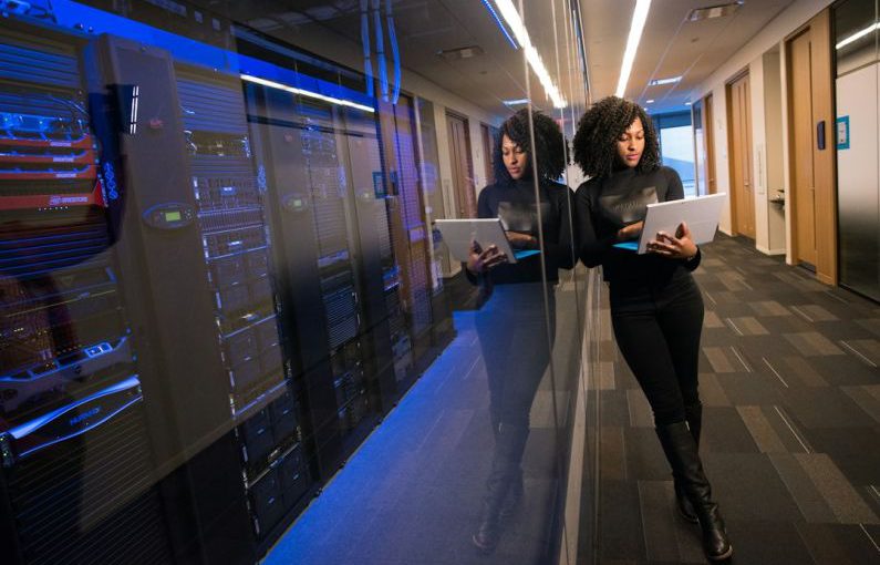 Technological Business - woman in black top using Surface laptop