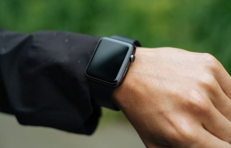 Fashion Tech - person wearing space gray Apple Watch turned off