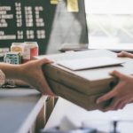 Local Business - person holding white printer paper