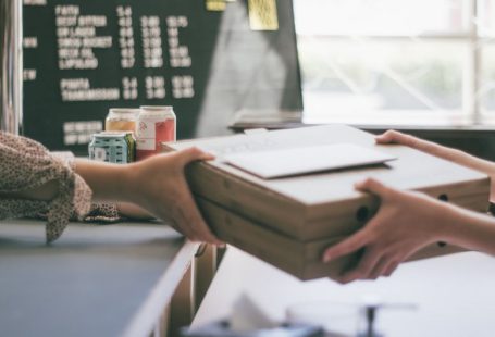 Local Business - person holding white printer paper