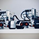 Robotics - two white and black electronic device with wheels