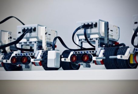 Robotics - two white and black electronic device with wheels