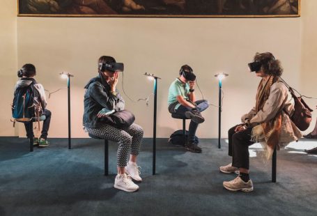 Virtual Reality - four person playing virtual reality goggles