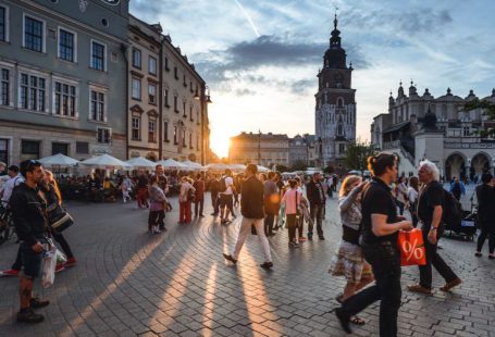 Tourism - people walking on street near concrete buildings