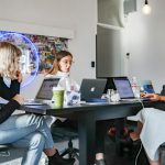 Startups - 3 women sitting on chair in front of table with laptop computers