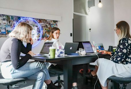 Startups - 3 women sitting on chair in front of table with laptop computers