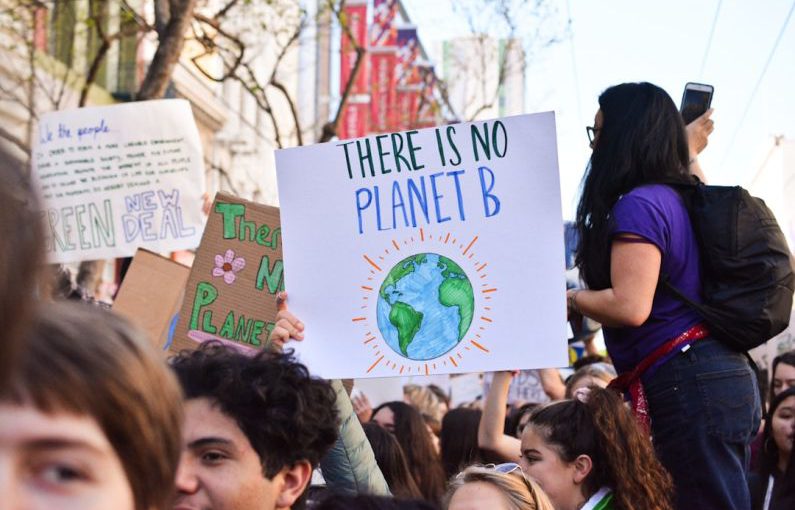 Climate - person holding there is no planet b poster