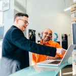 Sales - unknown person using laptop