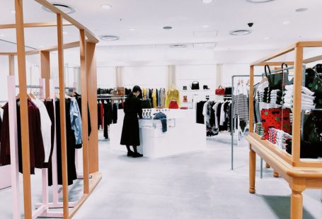 Retail - woman standing inside clothing area