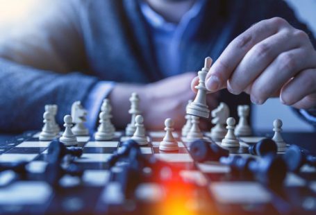 Digital Business - depth of field photography of man playing chess