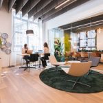 Coworking - woman in black shirt sitting on brown chair