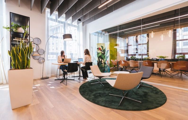 Coworking - woman in black shirt sitting on brown chair