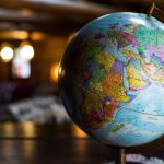 International Trade - desk globe on table