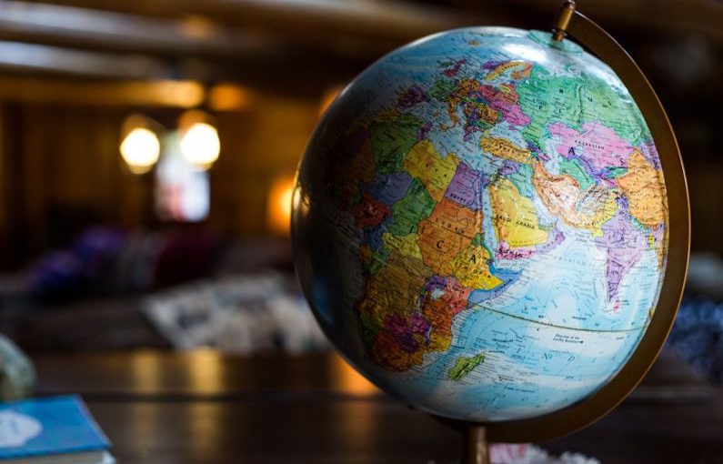 International Trade - desk globe on table