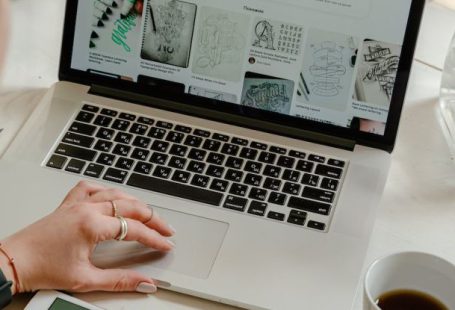 Patent Process - Person Using Macbook Pro on Table