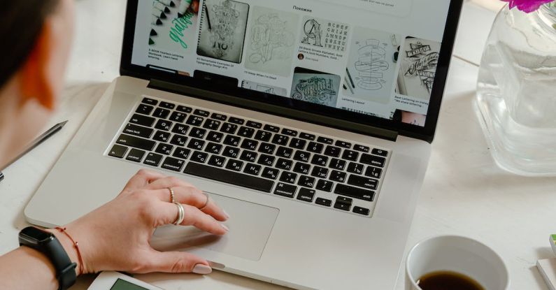 Patent Process - Person Using Macbook Pro on Table