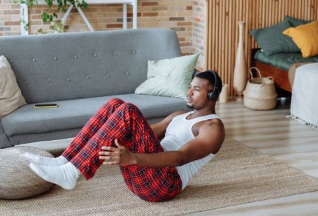 Fitness Gadgets - A Man Exercising while Wearing Headphones