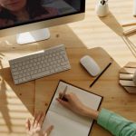 Online Training - Person Writing on Notebook