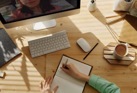 Online Training - Person Writing on Notebook