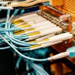 Tech Hub - Modern hardware and structured cabling system with patch cords inserted into patch panel outlets