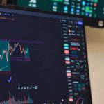 Investment Graph - A laptop with a screen displaying a chart