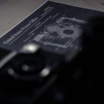 Patent Document - High angle collection of professional retro photo and film cameras arranged on table with patent document