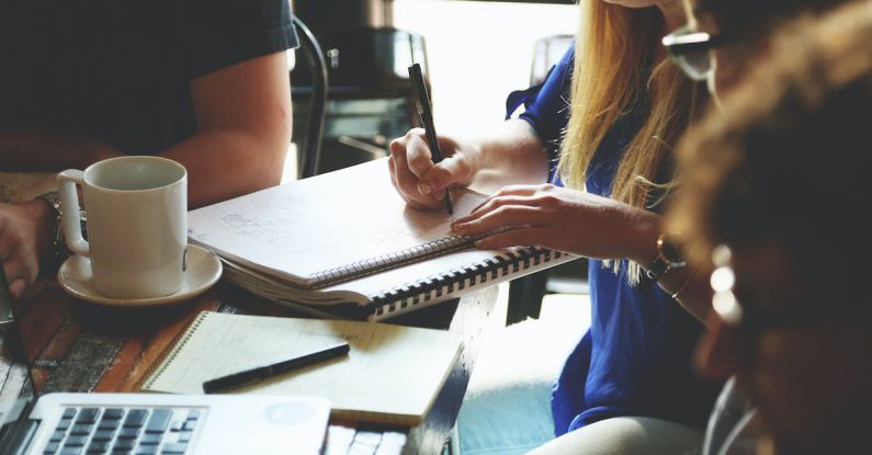 Startup Advice - Person Writing on the Notebook